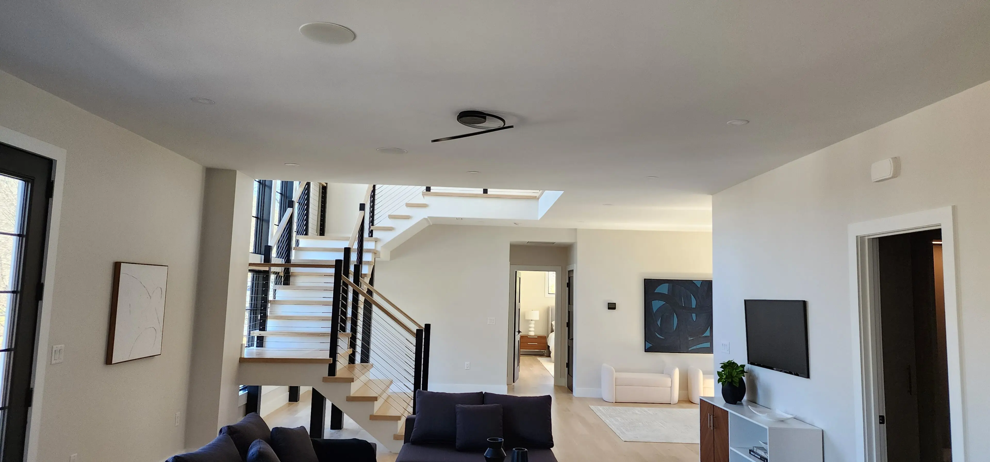 A living room with stairs and a couch