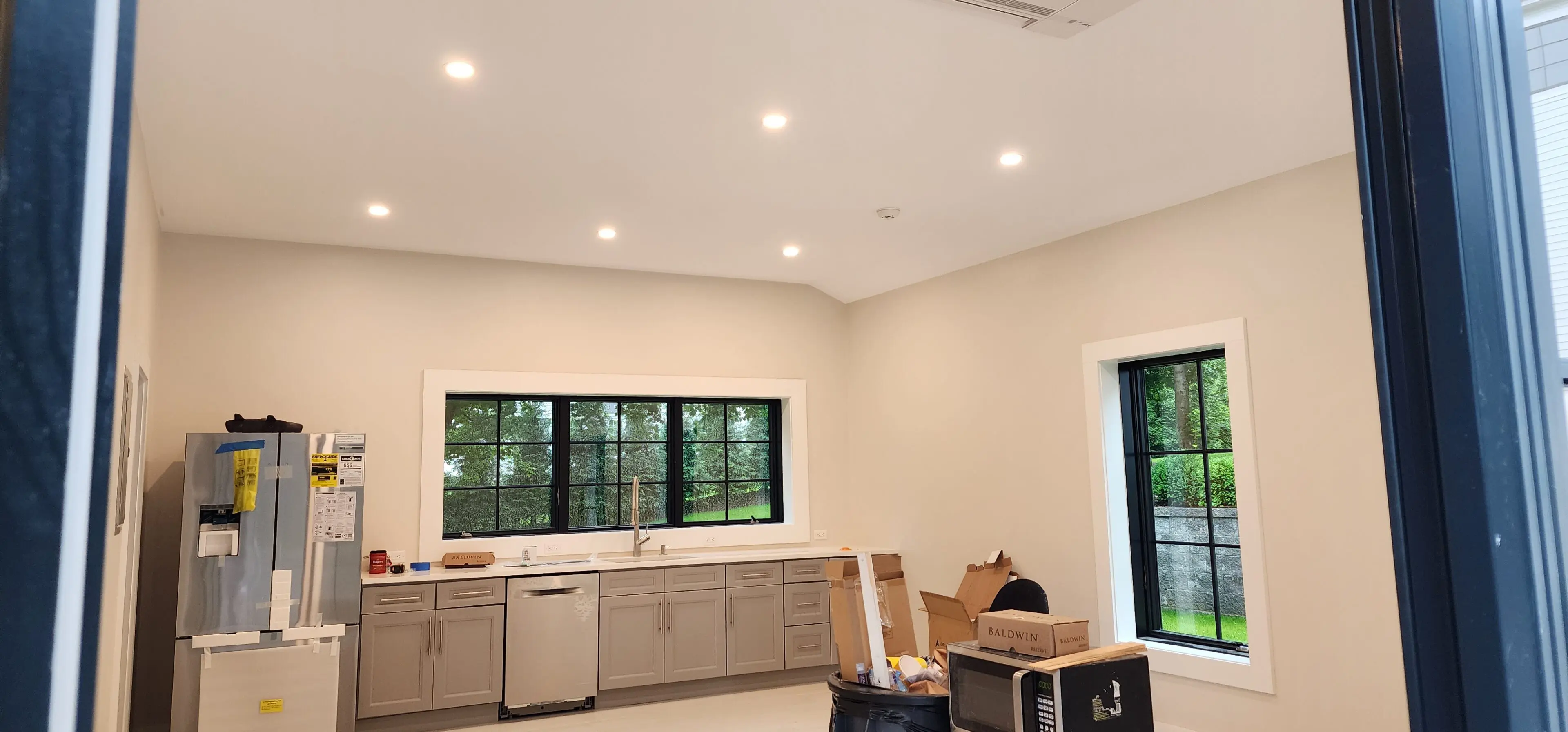 A room with boxes and cabinets in it