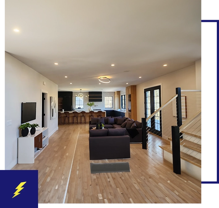 A living room with hard wood floors and furniture.